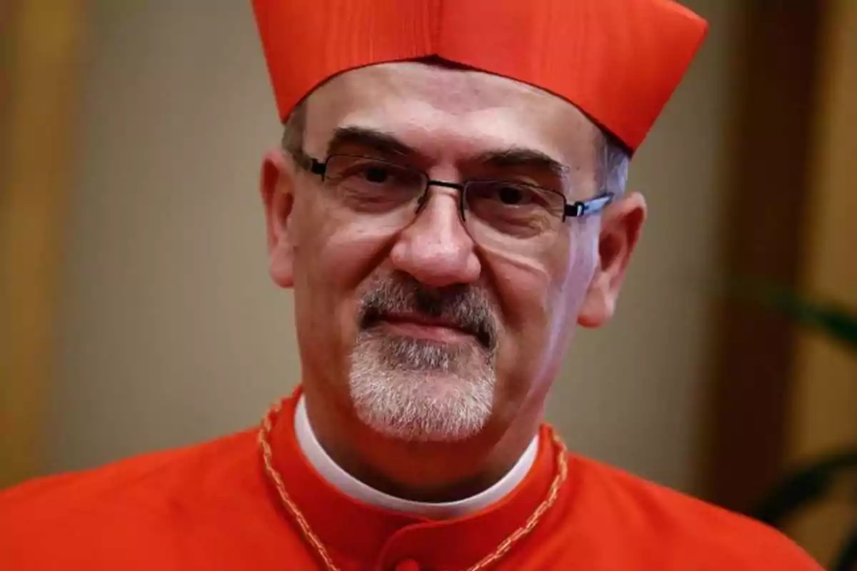 A man in red religious attire and a matching hat. A man in red religious attire and a matching hat.