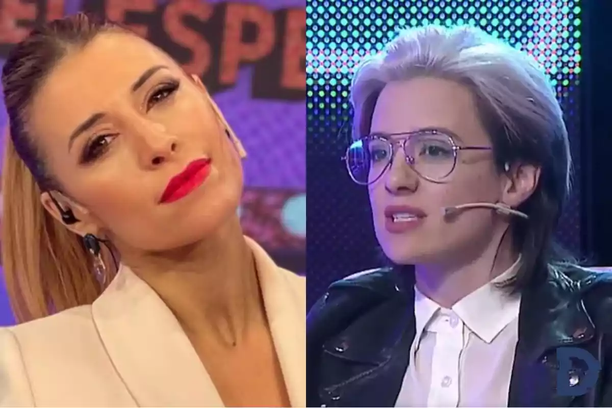 Dos personas en un programa de televisión, una con cabello recogido y labios rojos, la otra con gafas y micrófono.