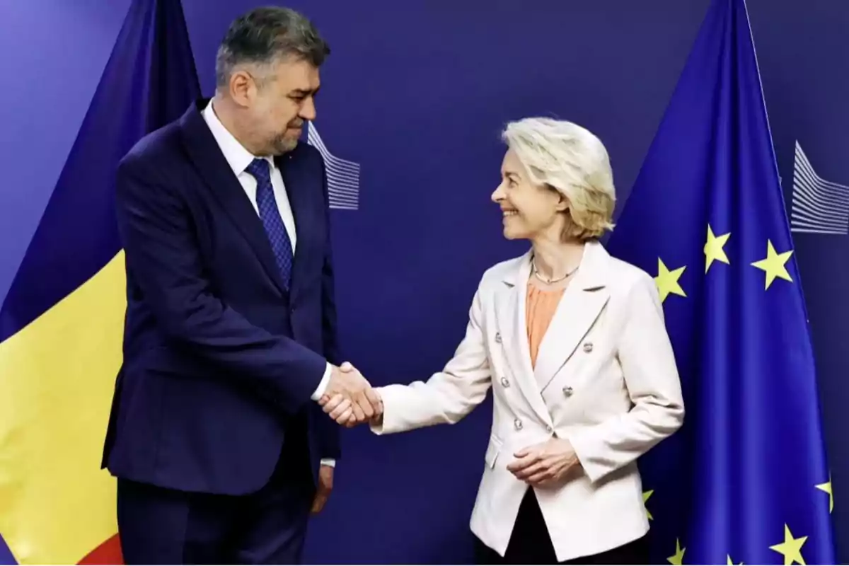Two people shaking hands in front of the flags of the European Union and another country. Two people shaking hands in front of the flags of the European Union and another country.