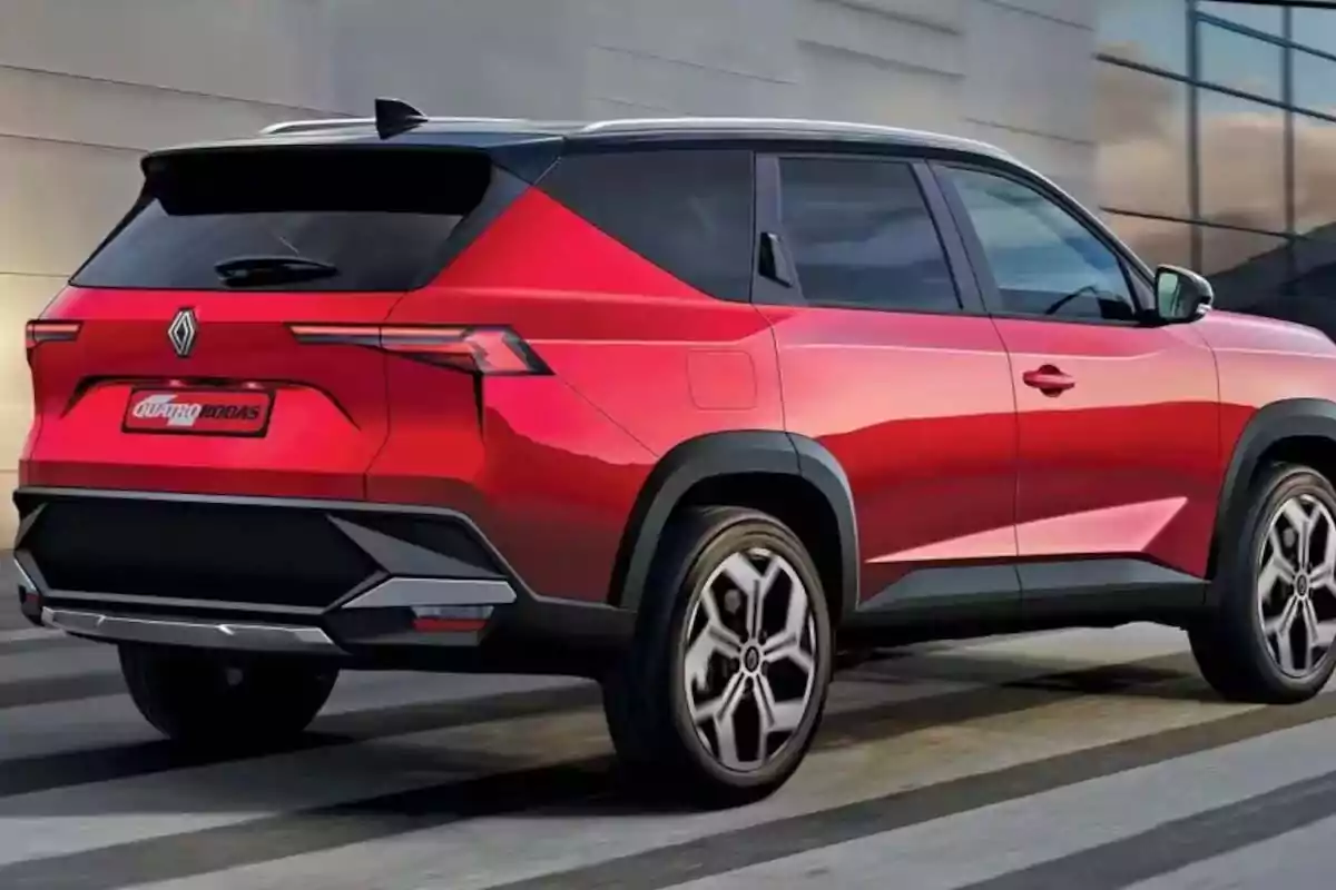 Modern-design red SUV with black and silver accents parked next to a glass building Modern-design red SUV with black and silver accents parked next to a glass building