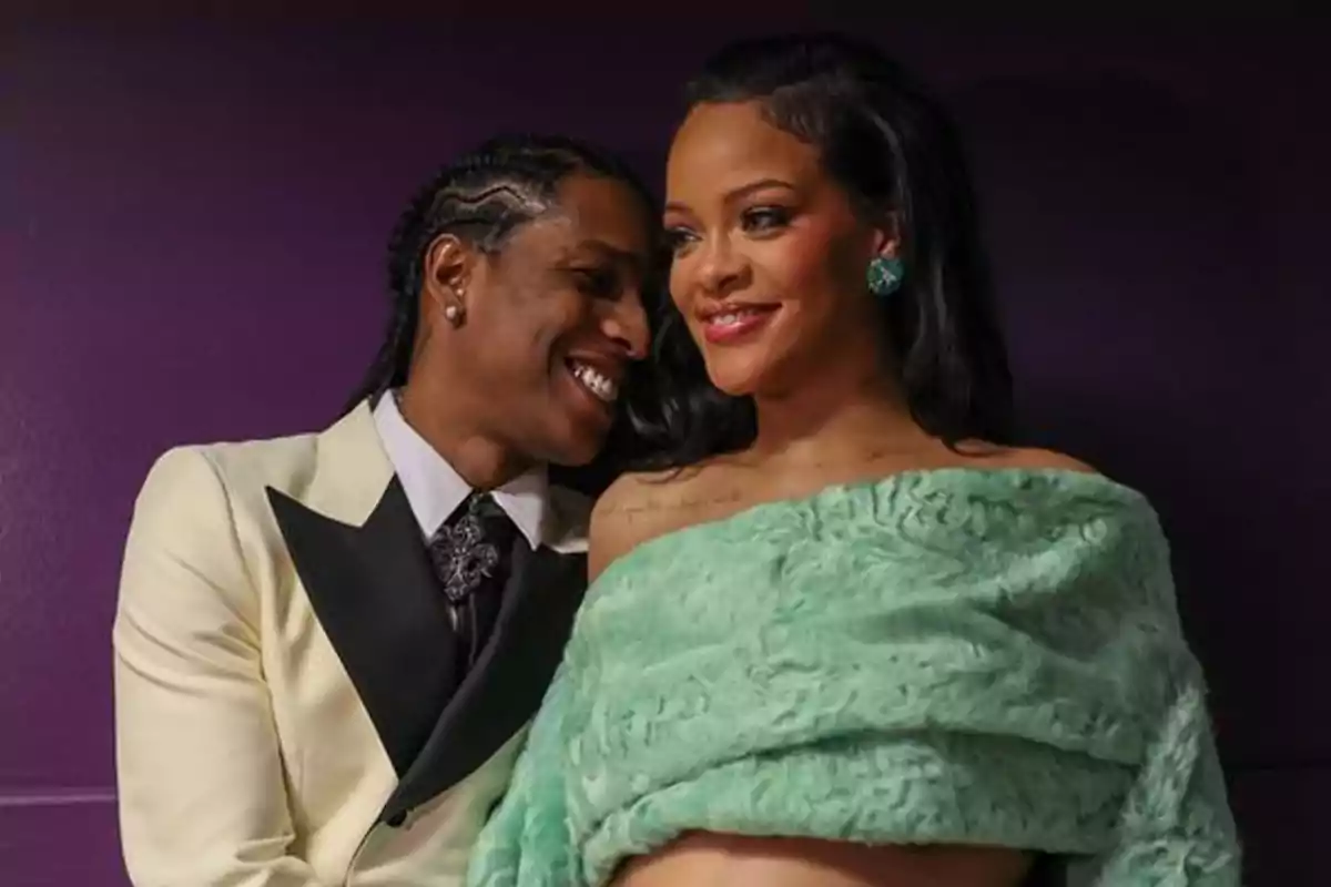 A smiling couple in an intimate and happy moment. A smiling couple in an intimate and happy moment.