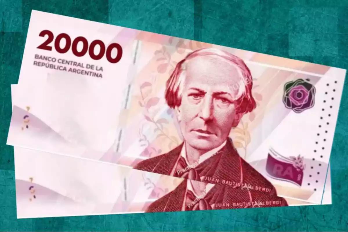 Billete de 20000 pesos argentinos con el retrato de una figura histórica sobre un fondo verde.