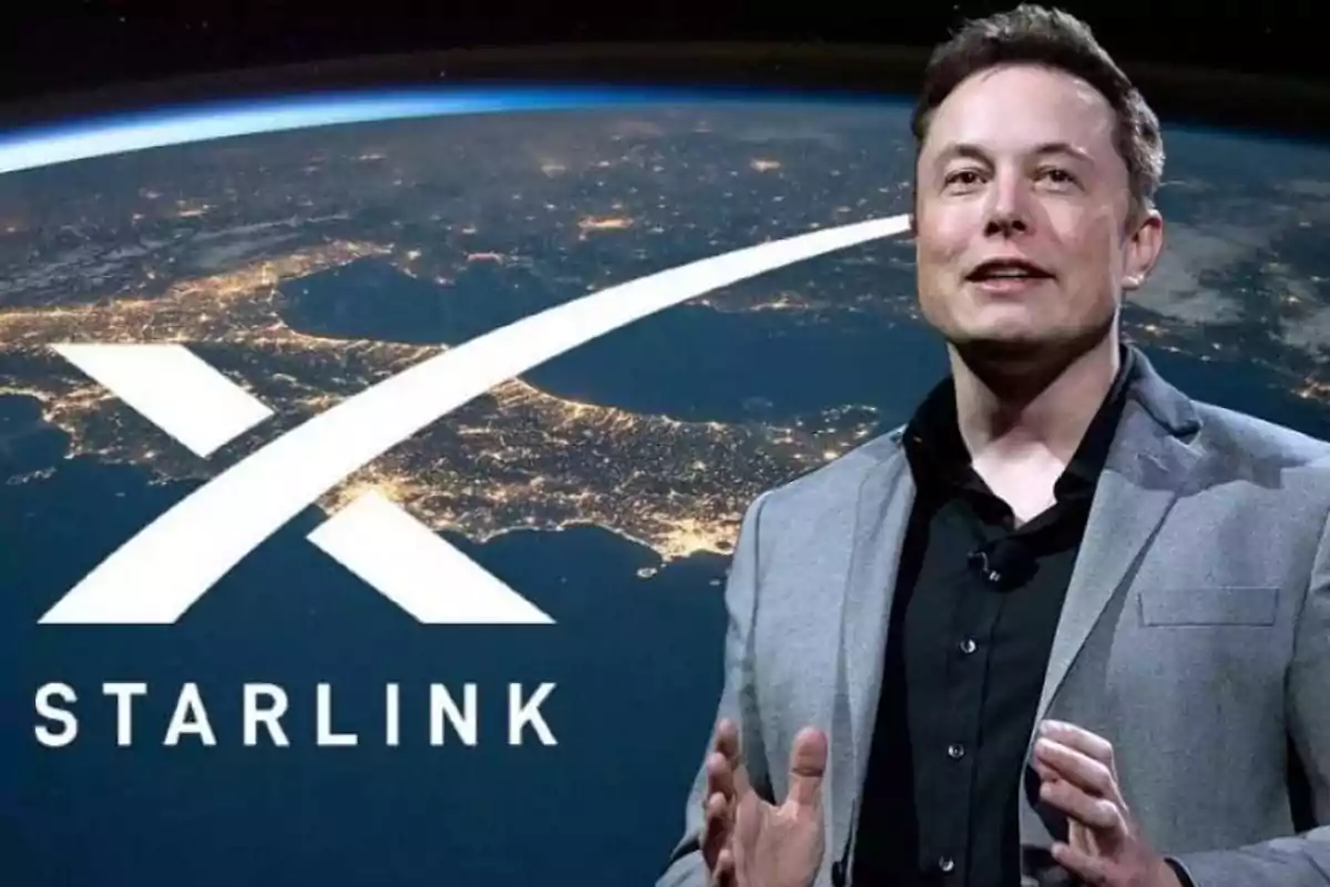 A man in a suit in front of a Starlink logo with a view of Earth illuminated from space.