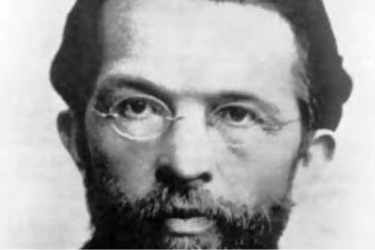 Black and white portrait of a man with a beard and round glasses Black and white portrait of a man with a beard and round glasses