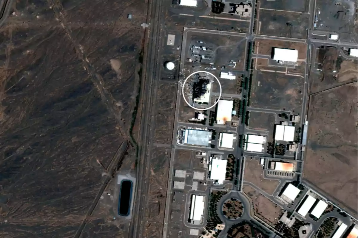 Aerial view of an industrial complex in a desert area with several buildings and an area marked with a white circle Aerial view of an industrial complex in a desert area with several buildings and an area marked with a white circle