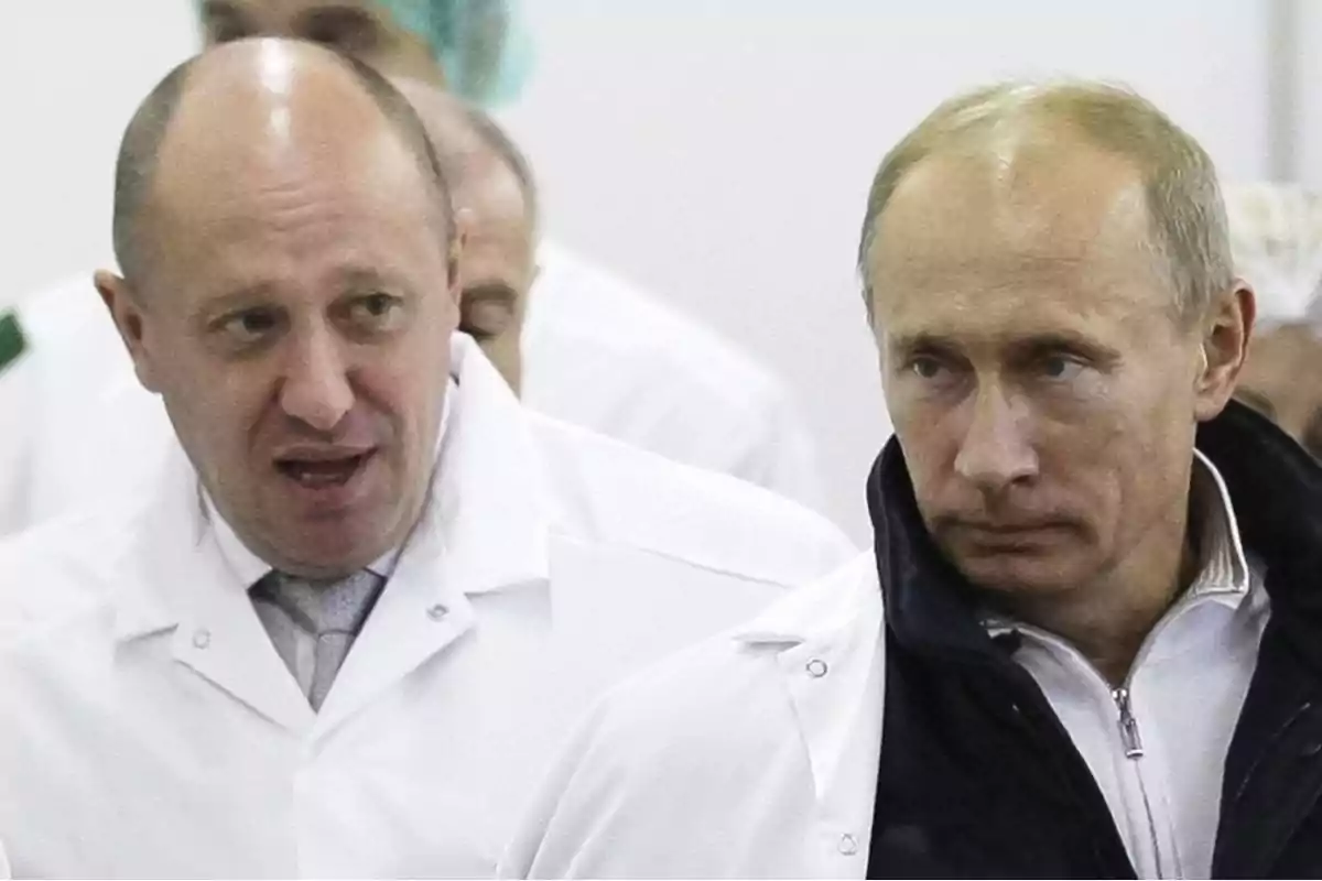 Two men in white lab coats in an indoor setting Two men in white lab coats in an indoor setting