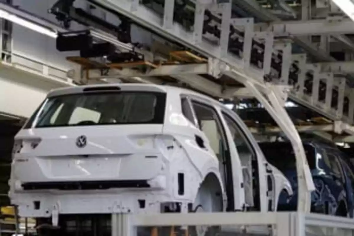 A vehicle in the process of being assembled on an automotive production line.