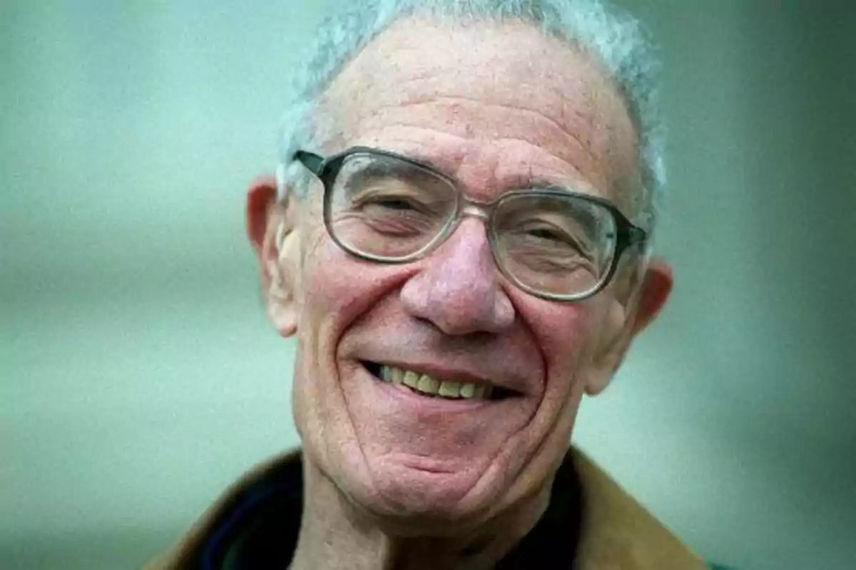An older man with glasses smiling. An older man with glasses smiling.
