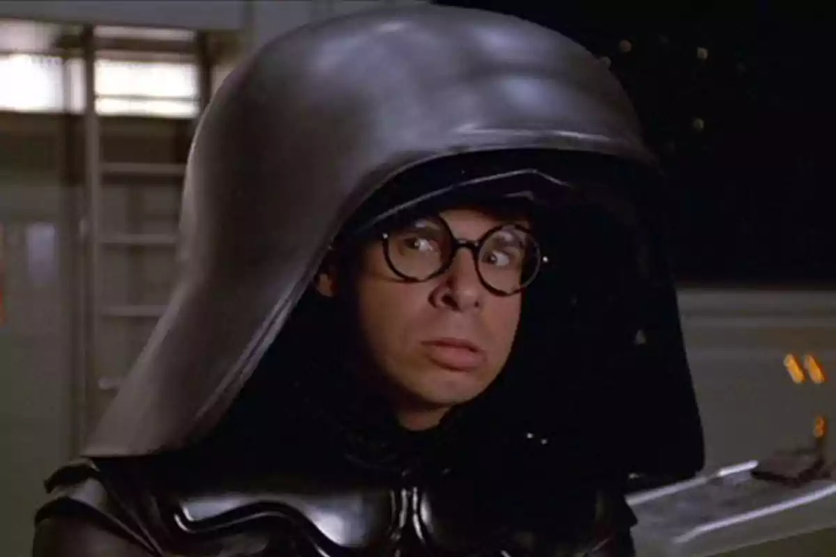 Man with glasses and a large black helmet looking to the side in a futuristic setting Man with glasses and a large black helmet looking to the side in a futuristic setting