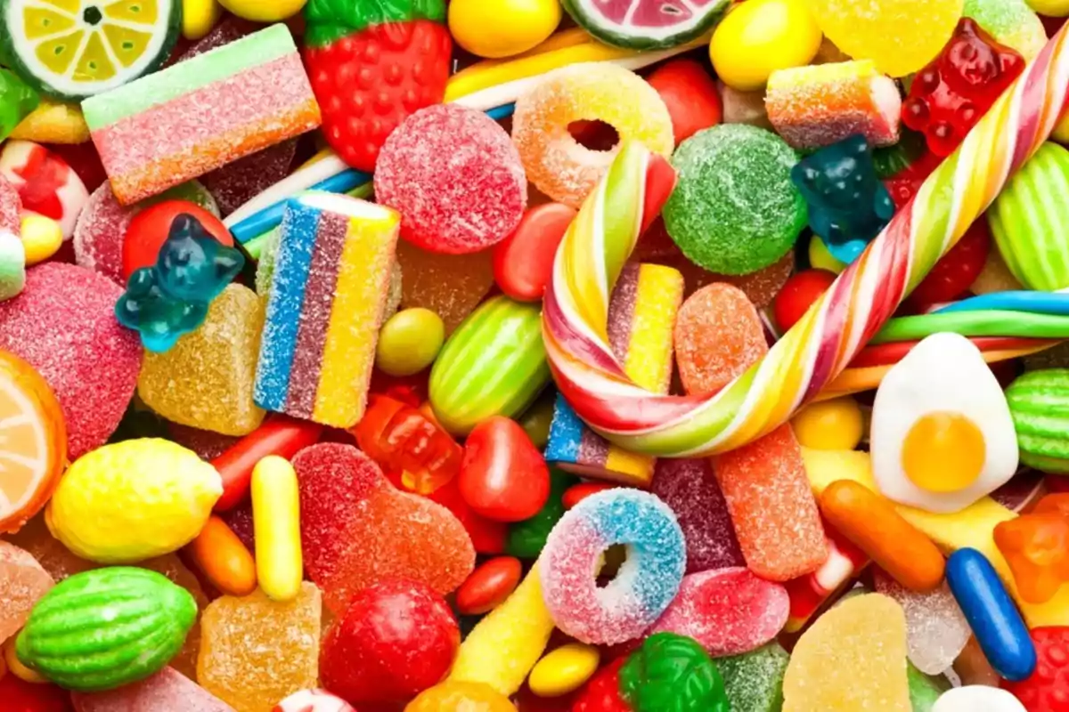 A colorful assortment of candies and sweets in different shapes and sizes. A colorful assortment of candies and sweets in different shapes and sizes.