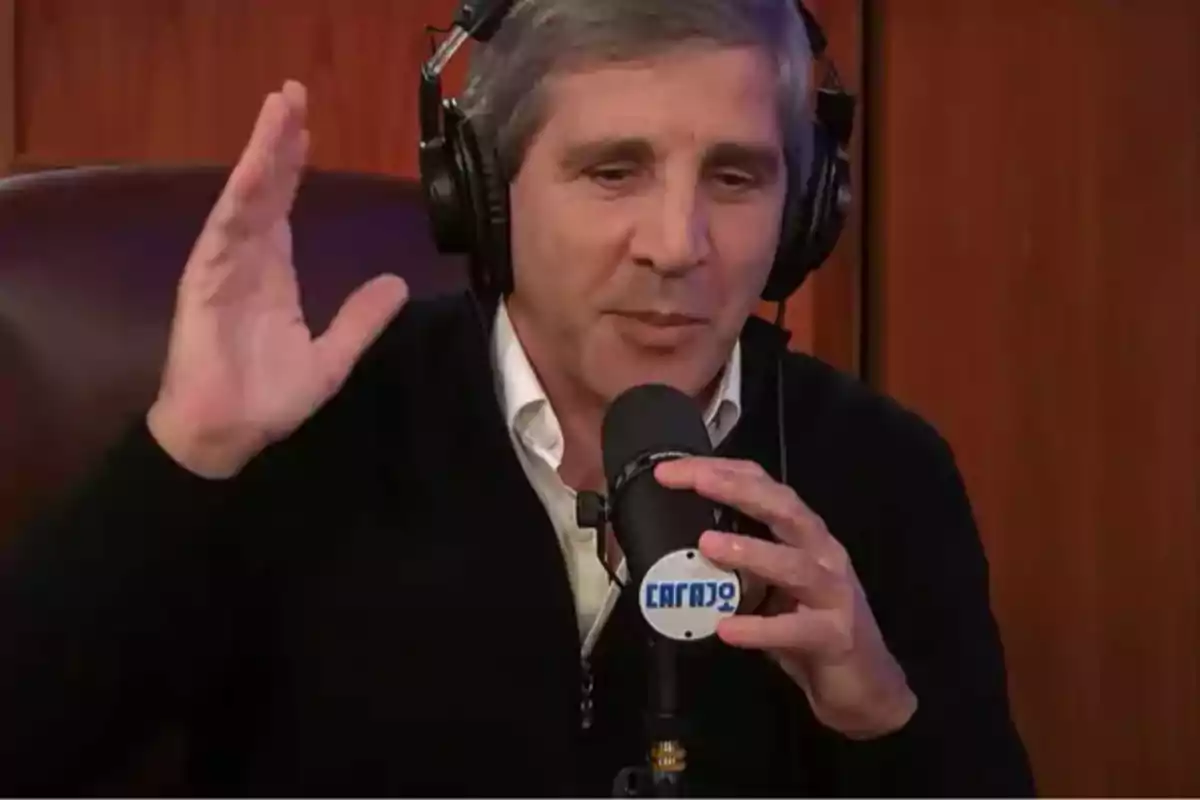 A man with headphones speaking into a microphone in a radio studio. A man with headphones speaking into a microphone in a radio studio.