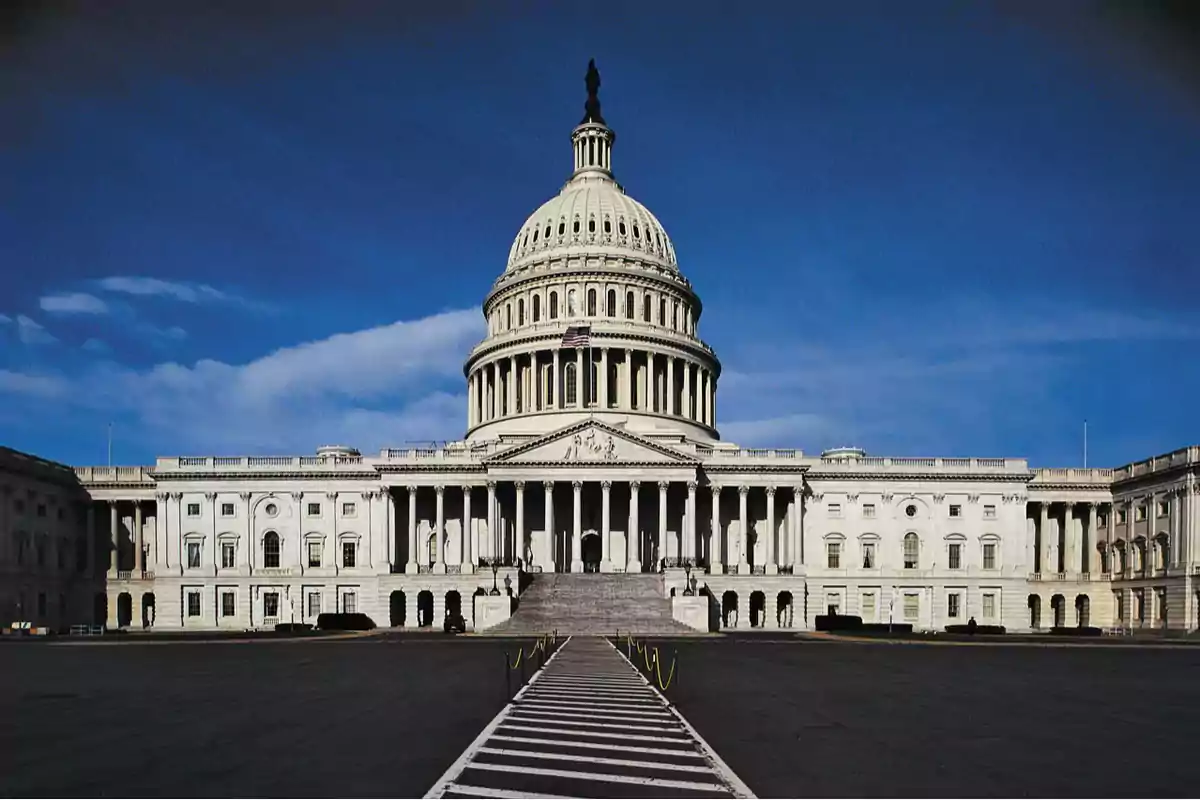 Main facade of the United States Capitol with clear blue sky Main facade of the United States Capitol with clear blue sky