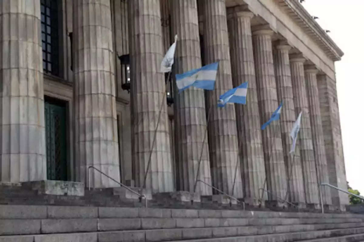 Building with classical columns and flags waving at the entrance. Building with classical columns and flags waving at the entrance.