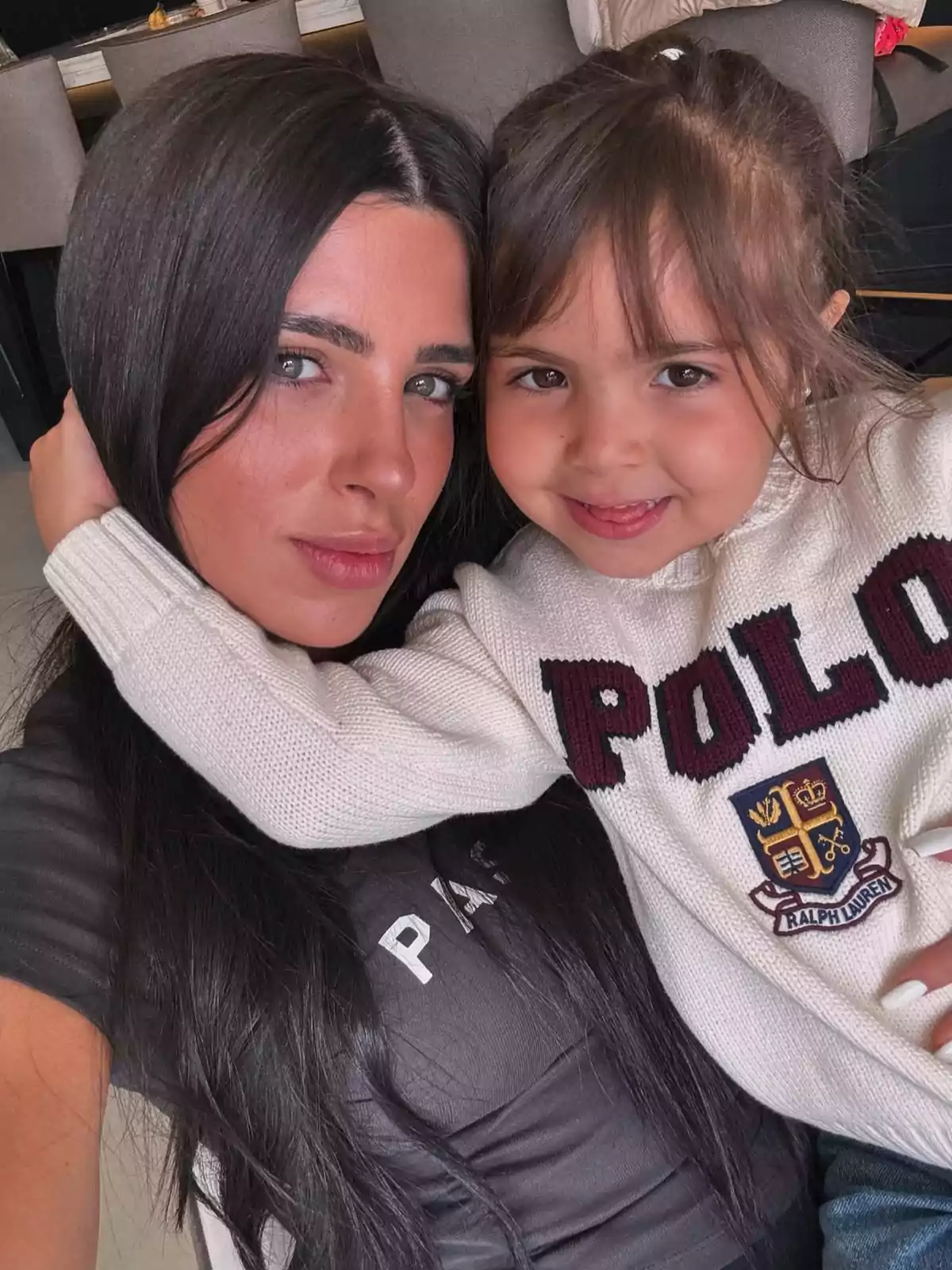 A woman and a girl smile as they pose together for a selfie, capturing a moment of closeness and joy. A woman and a girl smile as they pose together for a selfie, capturing a moment of closeness and joy.