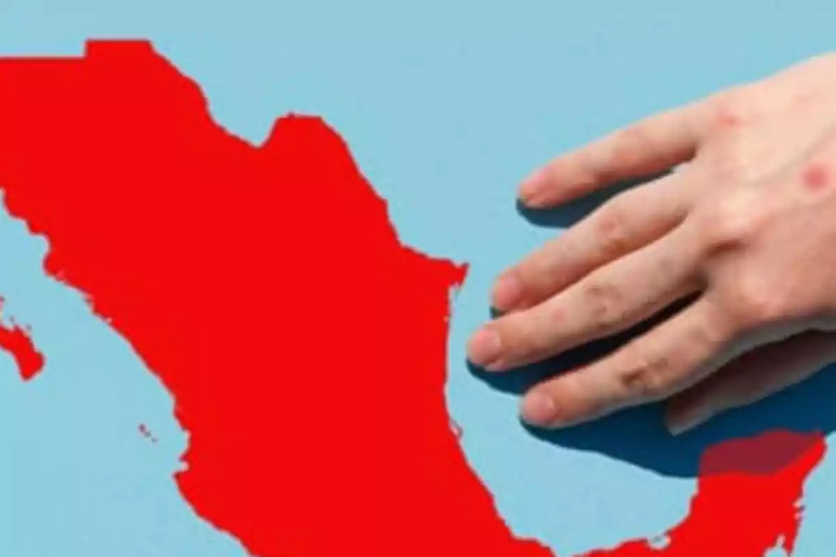 A hand over a red map of Mexico on a blue background. A hand over a red map of Mexico on a blue background.