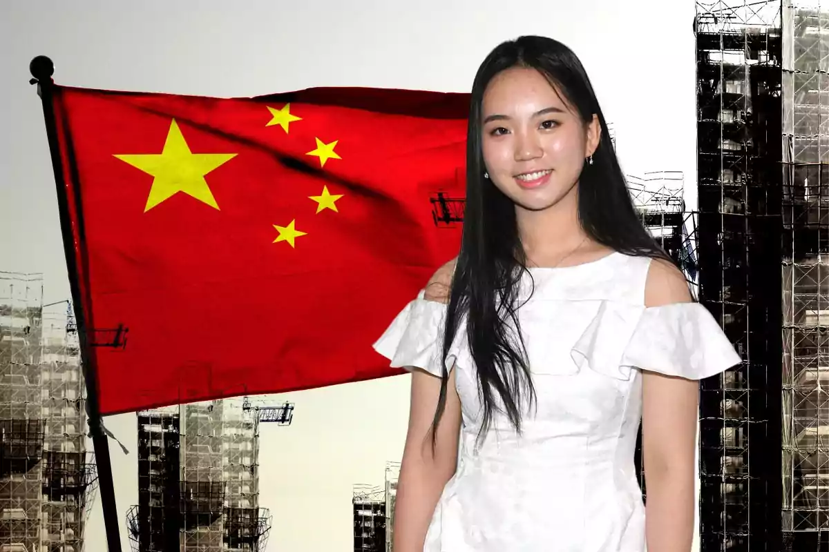 Young woman in a white dress posing in front of a Chinese flag and buildings under construction