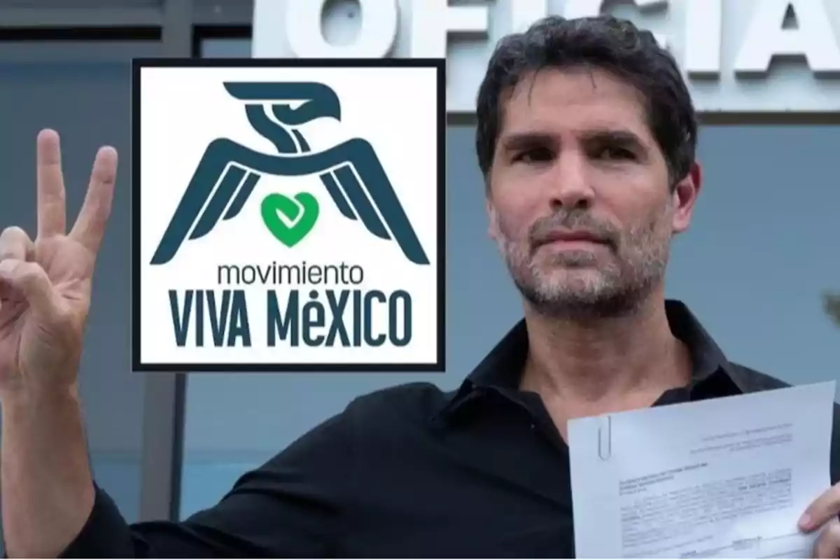 Dark-haired, bearded man holds a document and makes the peace sign with his fingers, next to a logo of a stylized eagle and a green heart with the text Dark-haired, bearded man holds a document and makes the peace sign with his fingers, next to a logo of a stylized eagle and a green heart with the text